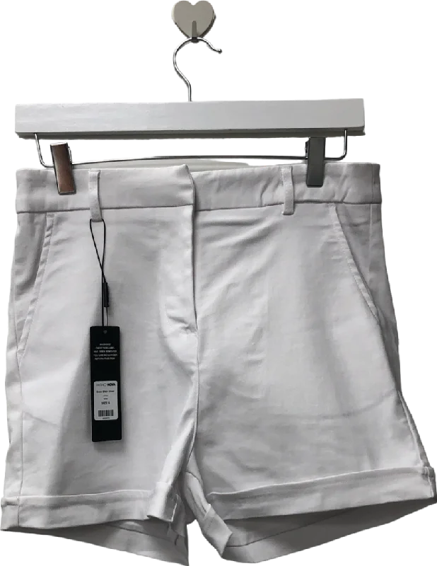 Tailored shorts – Well-fitted, structured shorts, often more formal or polished for work or events.Fashion Nova White Boss Shorts UK S