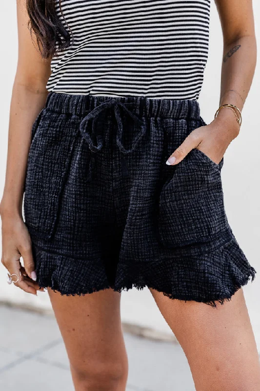 Pleated shorts – Shorts with pleats at the waist for extra volume or texture, creating a more sophisticated appearance.Ready To Go Black Acid Wash Gauze Ruffle Hem Pull On Shorts FINAL SALE