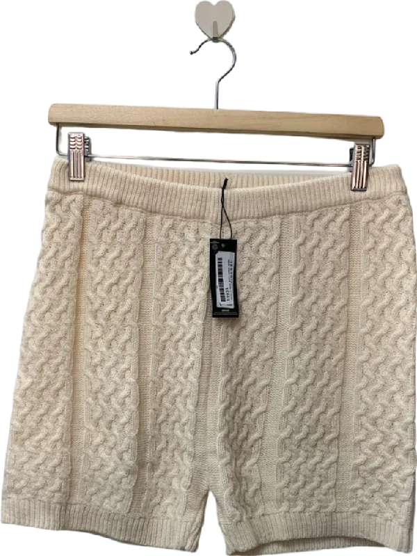 Denim shorts – Shorts made from denim fabric, often associated with a casual, summery vibe.PrettyLittleThing Cream Cable Knit Shorts UK M