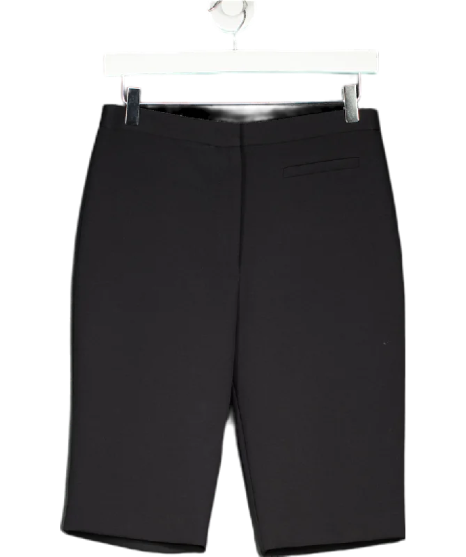 Skort – A hybrid of shorts and a skirt, with a skirt overlay at the front for a feminine touch.Milly New York Black longline shorts UK 8