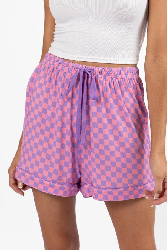 Tailored shorts – Well-fitted, structured shorts, often more formal or polished for work or events.Good To Get Away Light Pink and Lilac Checkered Pajama Shorts