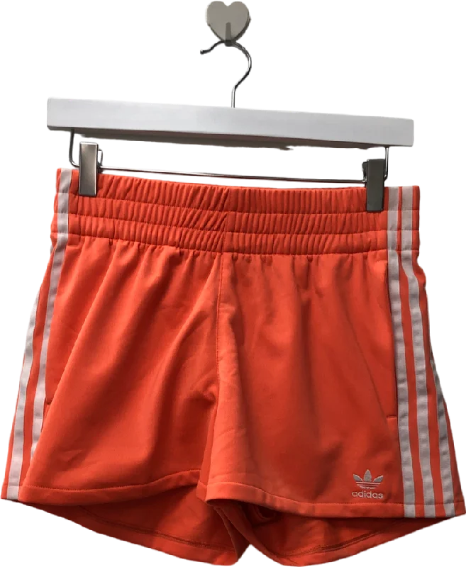 Linen shorts – Lightweight and breathable shorts made from linen, ideal for hot weather.adidas Orange Three Stripe Coral Shorts UK L