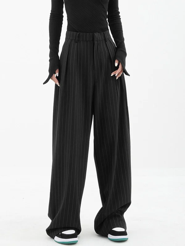 Flared trousers – Trousers with a gradual flare from the knee down, often associated with retro or 1970s fashion.BerryBetty - Baggy Pinstripe Wide Leg Dress Pants