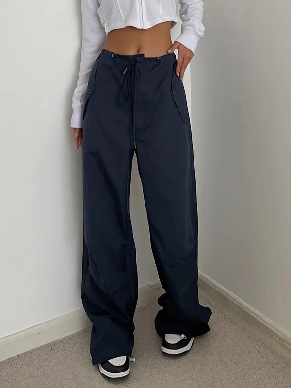 Slim-fit trousers – Trousers that are form-fitting and narrow through the legs.BerryBetty - City Cargo Parachute Pants