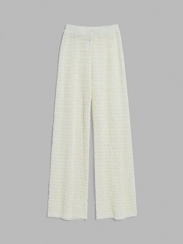 Flared trousers – Trousers with a gradual flare from the knee down, often associated with retro or 1970s fashion.BerryBetty - Crochet Wide Leg Pants