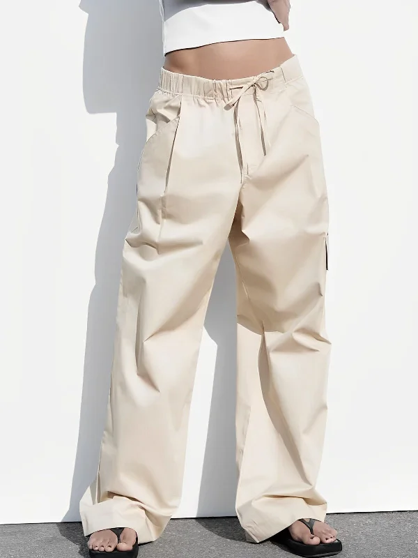 Bootcut trousers – Slightly flared at the bottom, designed to accommodate boots underneath.BerryBetty - Drawstring Cargo Parachute Pants