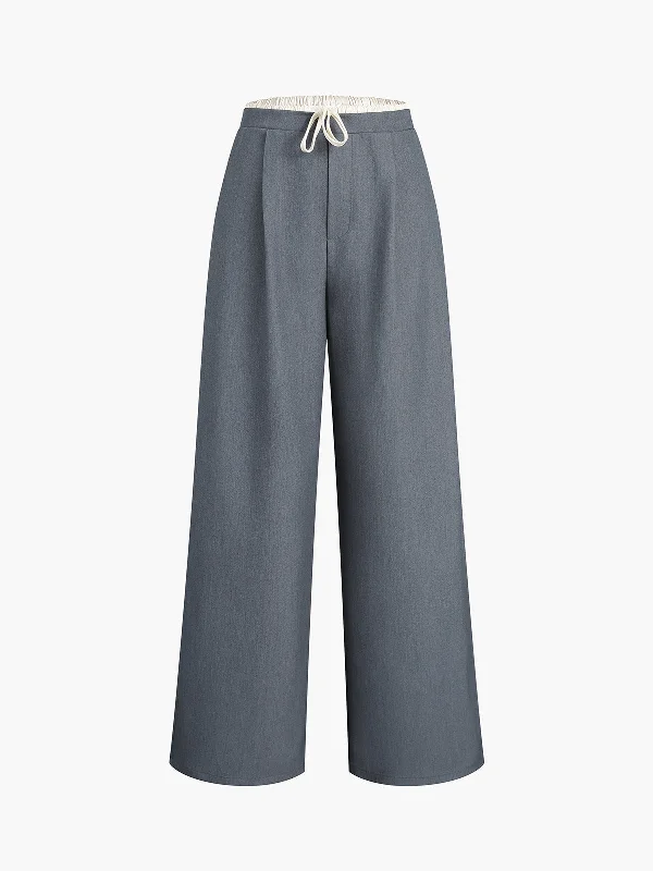 Palazzo trousers – Wide-leg trousers made from light, flowy fabric, often associated with a chic or bohemian look.BerryBetty - Drawstring Pockets Smart Wide Leg Pants