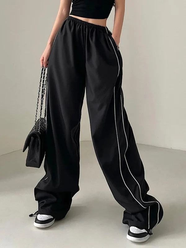 Bootcut trousers – Slightly flared at the bottom, designed to accommodate boots underneath.BerryBetty - Leisure Baggy Drawstring Parachute Pants