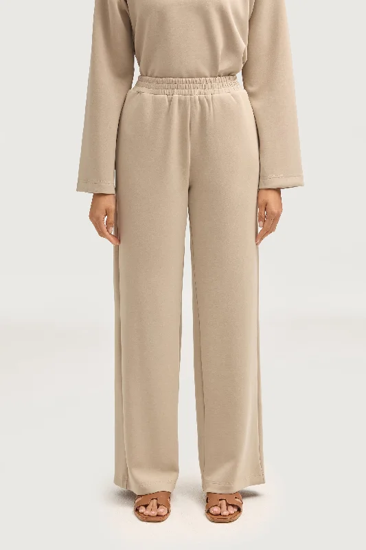 Booty-lifting trousers – Trousers designed with specific stitching or structure to enhance the shape of the rear.Maya Everyday Wide Leg Pants - Cloud