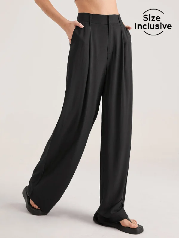 Booty-lifting trousers – Trousers designed with specific stitching or structure to enhance the shape of the rear.BerryBetty - Oversized High Waisted Pleat Front Trousers