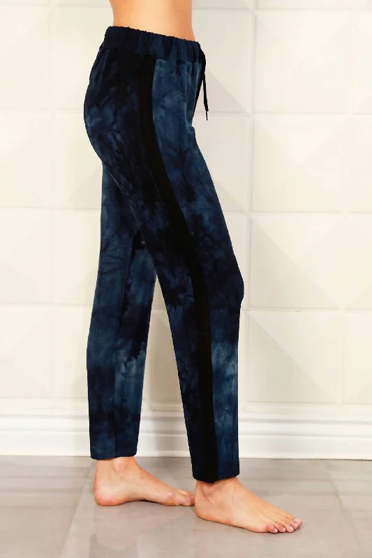 Flared trousers – Trousers with a gradual flare from the knee down, often associated with retro or 1970s fashion.Tie Dye Track Jogger In Ink Black