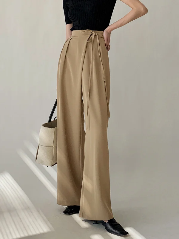 Wide-leg trousers – Trousers with a loose, flared fit from the hips down to the ankles.BerryBetty - Tie Waist Flowy Wide Leg Dress Pants