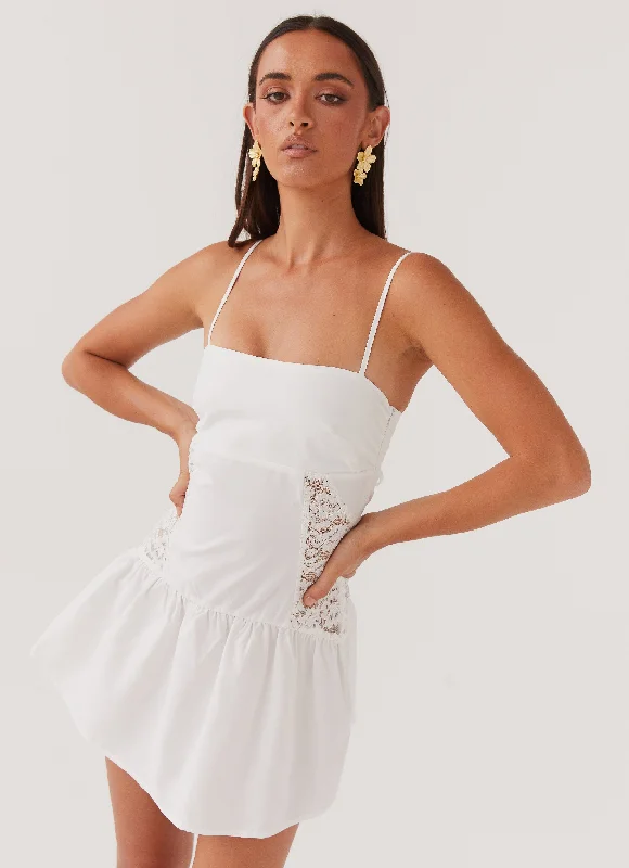 Wrap skirt – Skirt that wraps around the waist and is usually tied at one side.Cotton Cloud Mini Dress - White