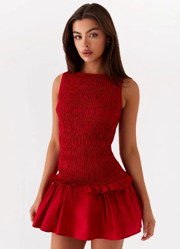 Pencil skirt – Tight-fitting skirt that hugs the body and usually falls to or just below the knee.Garden Kisses Shirred Mini Dress - Red