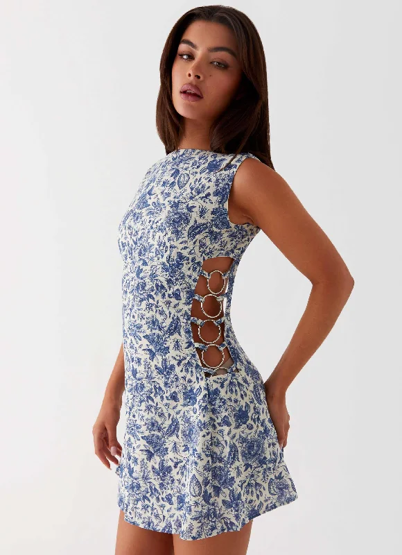 Ruffle skirt – Skirt with ruffled edges or layers, adding movement and texture.Indigo Bloom Linen Mini Dress - Blue Paisley