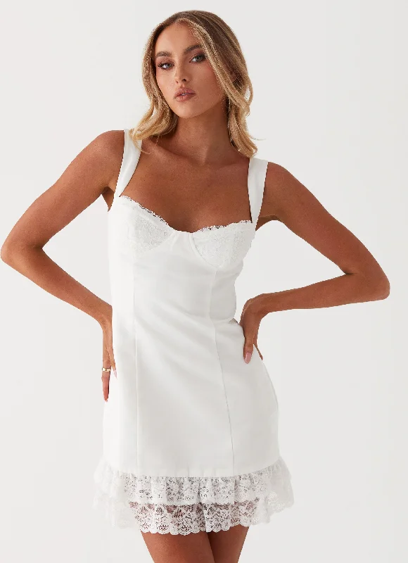 Slip skirt – A silky or satin skirt that mimics a slip dress, often worn for a smooth, elegant look.Isadora Lace Mini Dress - White