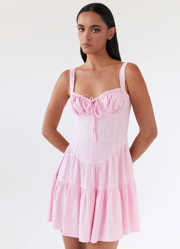 Ruffle skirt – Skirt with ruffled edges or layers, adding movement and texture.Lucie Linen Mini Dress - Pink