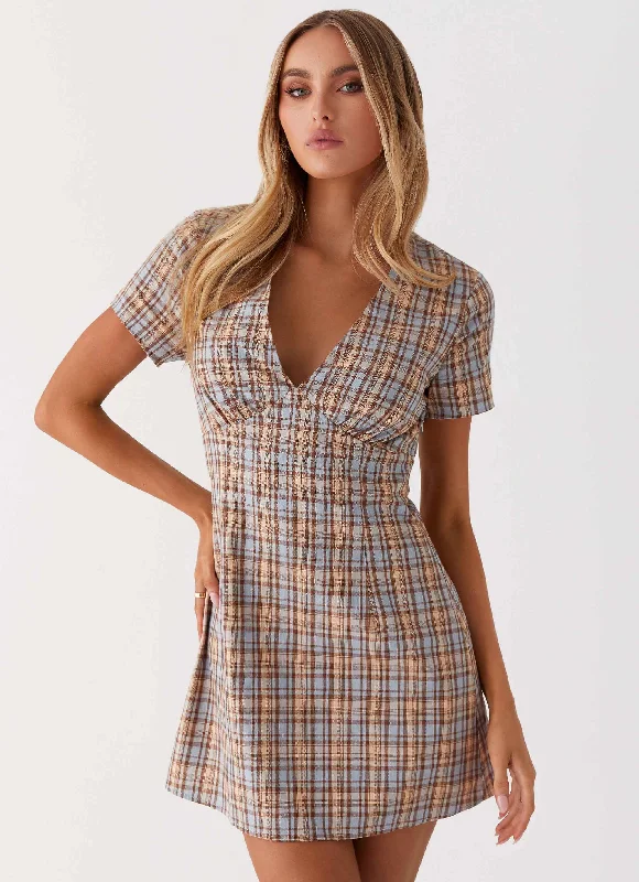 Asymmetrical skirt – Skirt with an uneven or diagonal hemline for a modern and unique appearance.Niki Cap Sleeve Mini Dress - Check