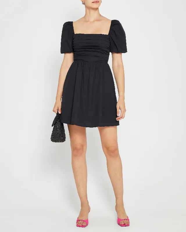 Asymmetrical skirt – Skirt with an uneven or diagonal hemline for a modern and unique appearance.River Mini Dress