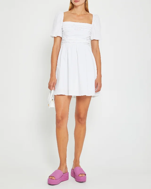 Asymmetrical skirt – Skirt with an uneven or diagonal hemline for a modern and unique appearance.River Mini Dress