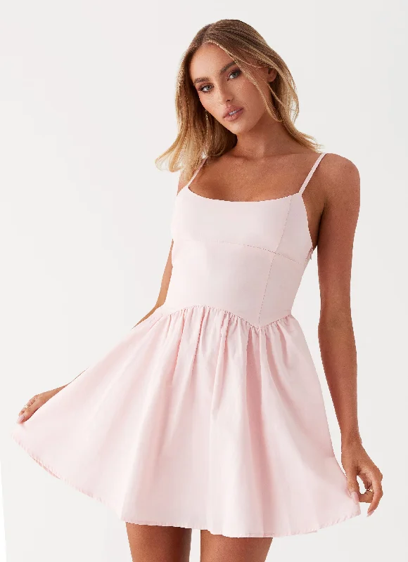 Asymmetrical skirt – Skirt with an uneven or diagonal hemline for a modern and unique appearance.Tesoro Mio Mini Dress - Pink