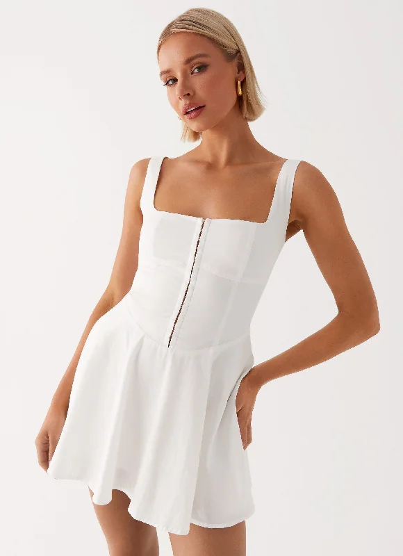 Cargo skirt – Skirt with utility-style pockets, similar to cargo pants.The Isle Mini Dress - White