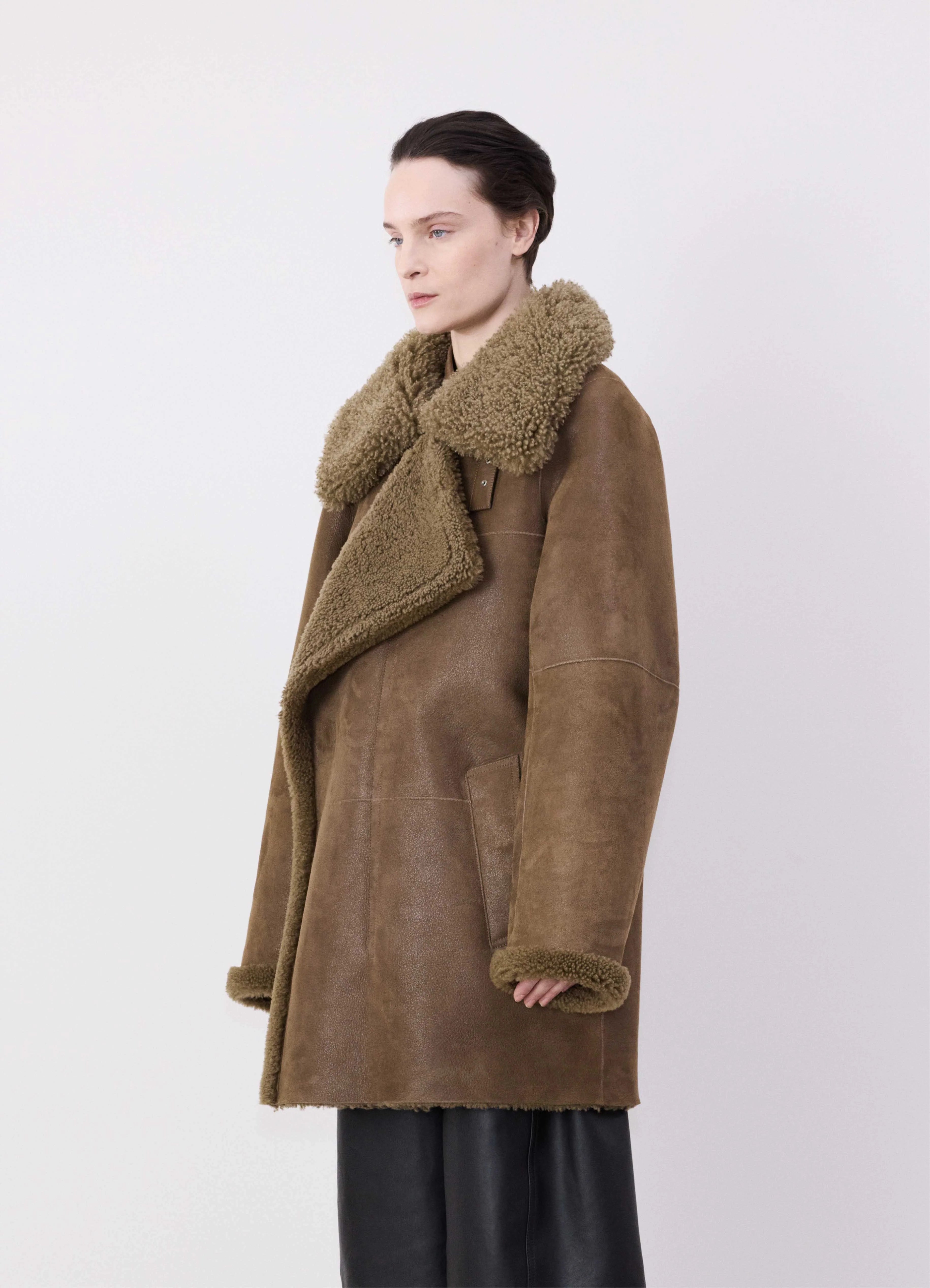 Warm – Insulated, cozyASYMMETRICAL SHEARLING COAT