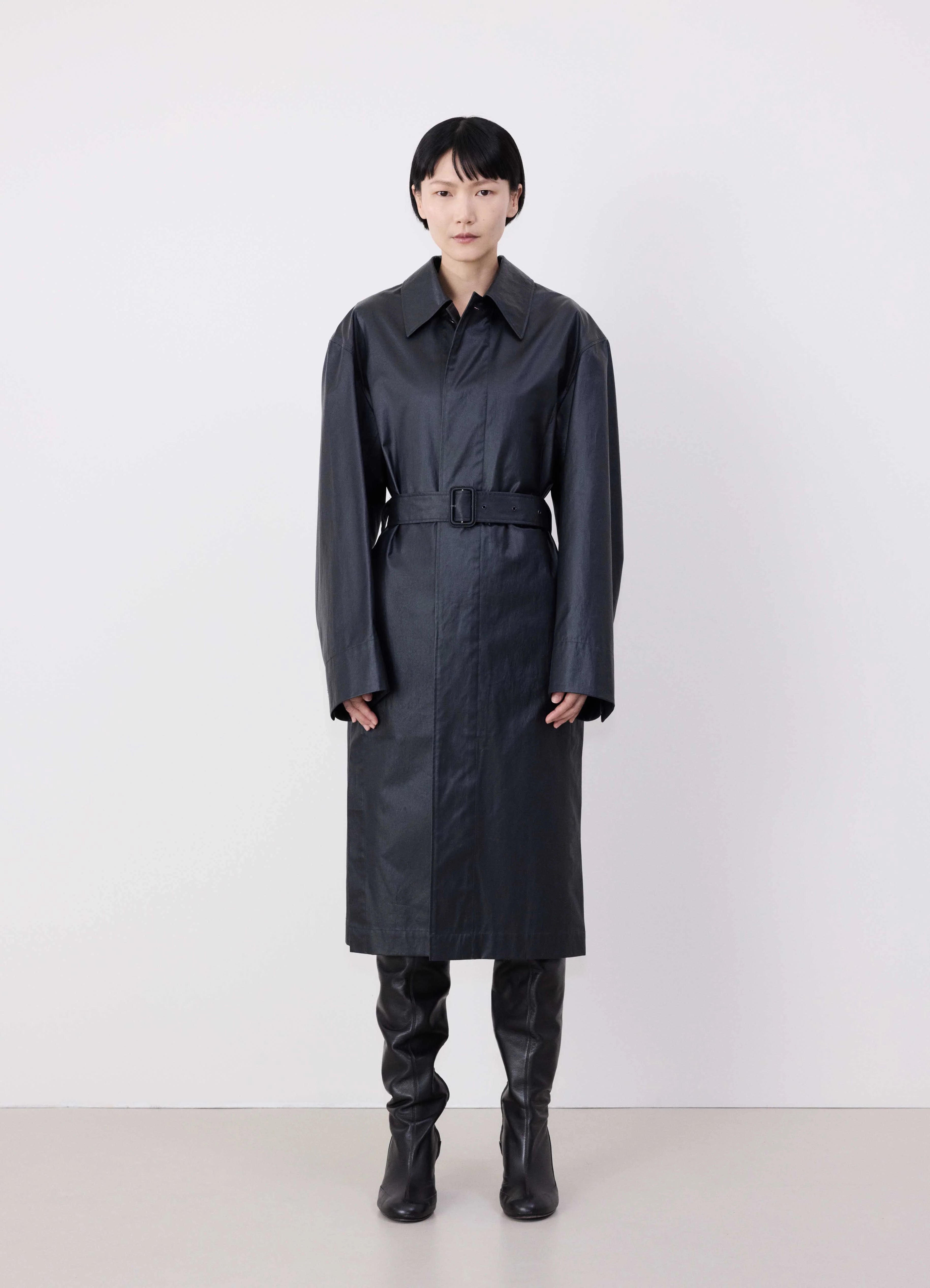 Quilted – Sewn in a pattern, often used for insulationBELTED RAIN COAT WITH SLITS