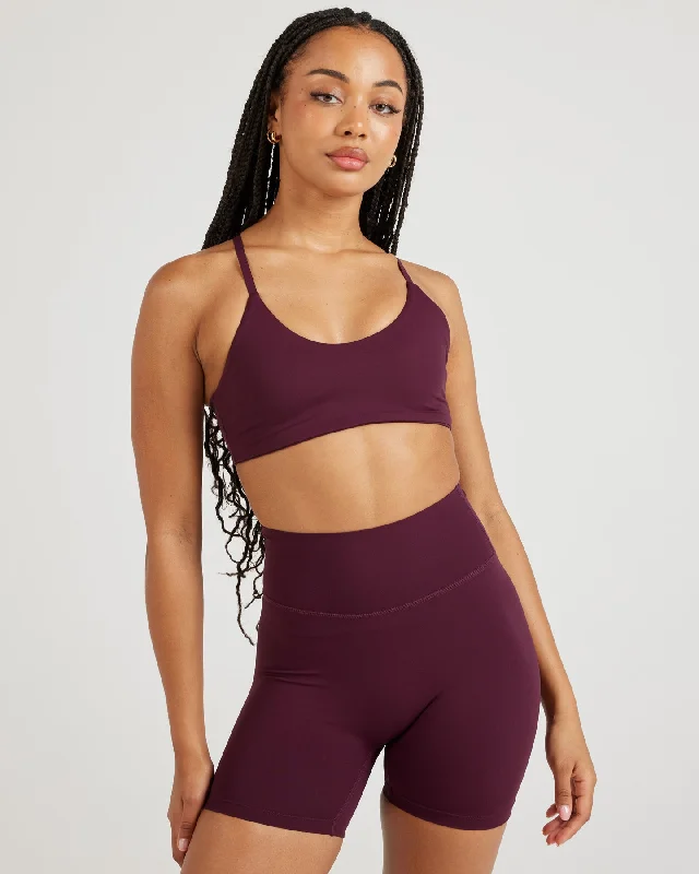 Push-up sports bra – Sports bra with added padding or structure to lift and shape the bust, providing extra support.Airey Micro Bra - Cherry Cola