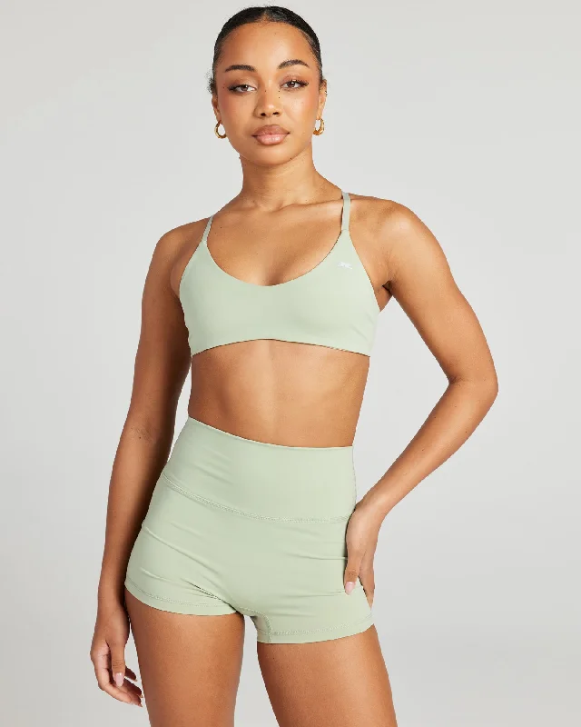 Compression tank sports bra – Combination of a tank top and sports bra, providing full coverage and support for the upper body.Aura Lite Bra - Light Sage