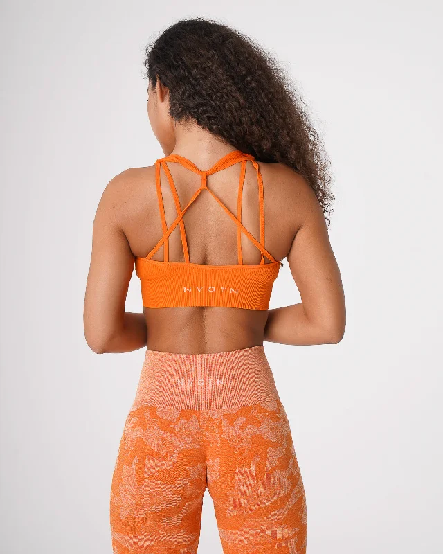 Push-up sports bra – Sports bra with added padding or structure to lift and shape the bust, providing extra support.Burnt Orange Galaxy Ribbed Seamless Bra