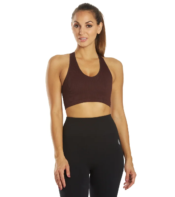 Racerback sports bra – Sports bra with a back design that features straps that meet in a "V" or "Y" shape, offering better shoulder mobility.Free People Free Throw Yoga Crop Black Raisin