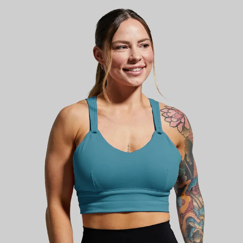 Racerback sports bra – Sports bra with a back design that features straps that meet in a "V" or "Y" shape, offering better shoulder mobility.Milk and Muscles Nursing Sports Bra (Prussian)