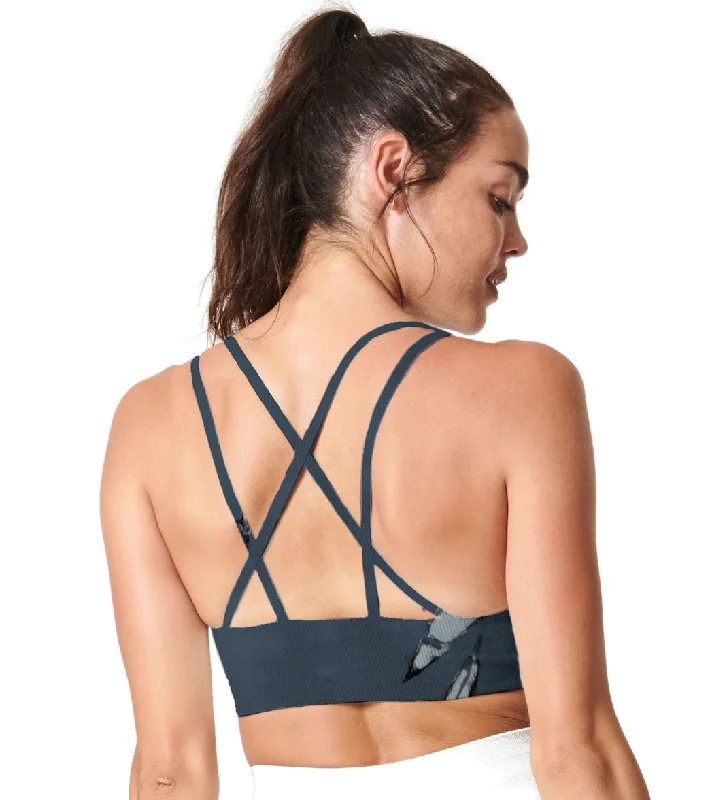 Racerback sports bra – Sports bra with a back design that features straps that meet in a "V" or "Y" shape, offering better shoulder mobility.NUX Hand-Dye Levitate Yoga Sports Bra Oceanic Marble