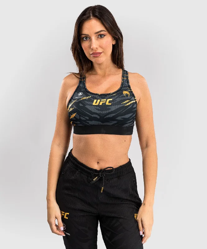 Push-up sports bra – Sports bra with added padding or structure to lift and shape the bust, providing extra support.UFC Fusion by Venum Authentic Fight Night Women’s Sports Bra - Champion