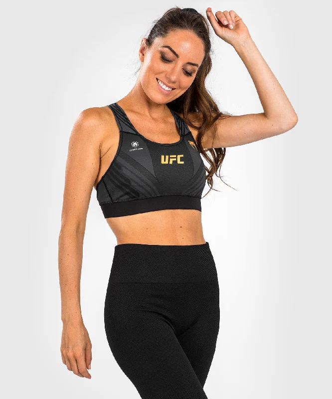 Vegan sports bra – Sports bra made from eco-friendly, cruelty-free materials, suitable for ethical consumers.UFC Venum Authentic Fight Night 1.0 Women's Sport Bra - Black/Gold