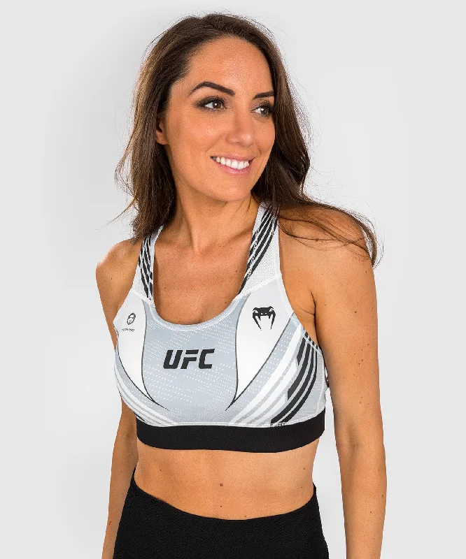 Front-closure sports bra – Sports bra that fastens at the front, often with hooks, zippers, or snaps, for easier wear.UFC Venum Authentic Fight Night 1.0 Women's Sport Bra - White