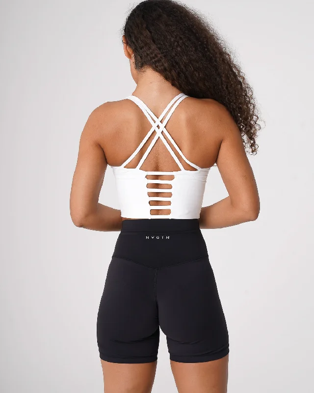 Front-closure sports bra – Sports bra that fastens at the front, often with hooks, zippers, or snaps, for easier wear.White Matrix Bra Top